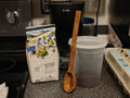 All purpose spoon in use stirring coffee grounds
