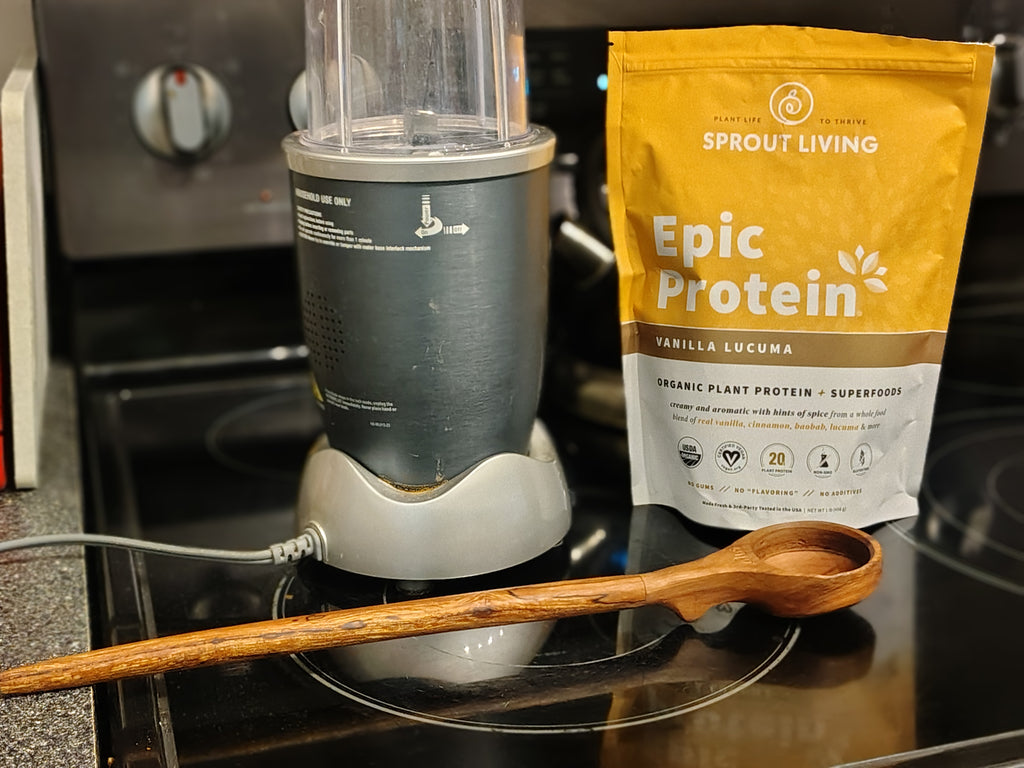 Measuring spoon in use with blender and protein powder