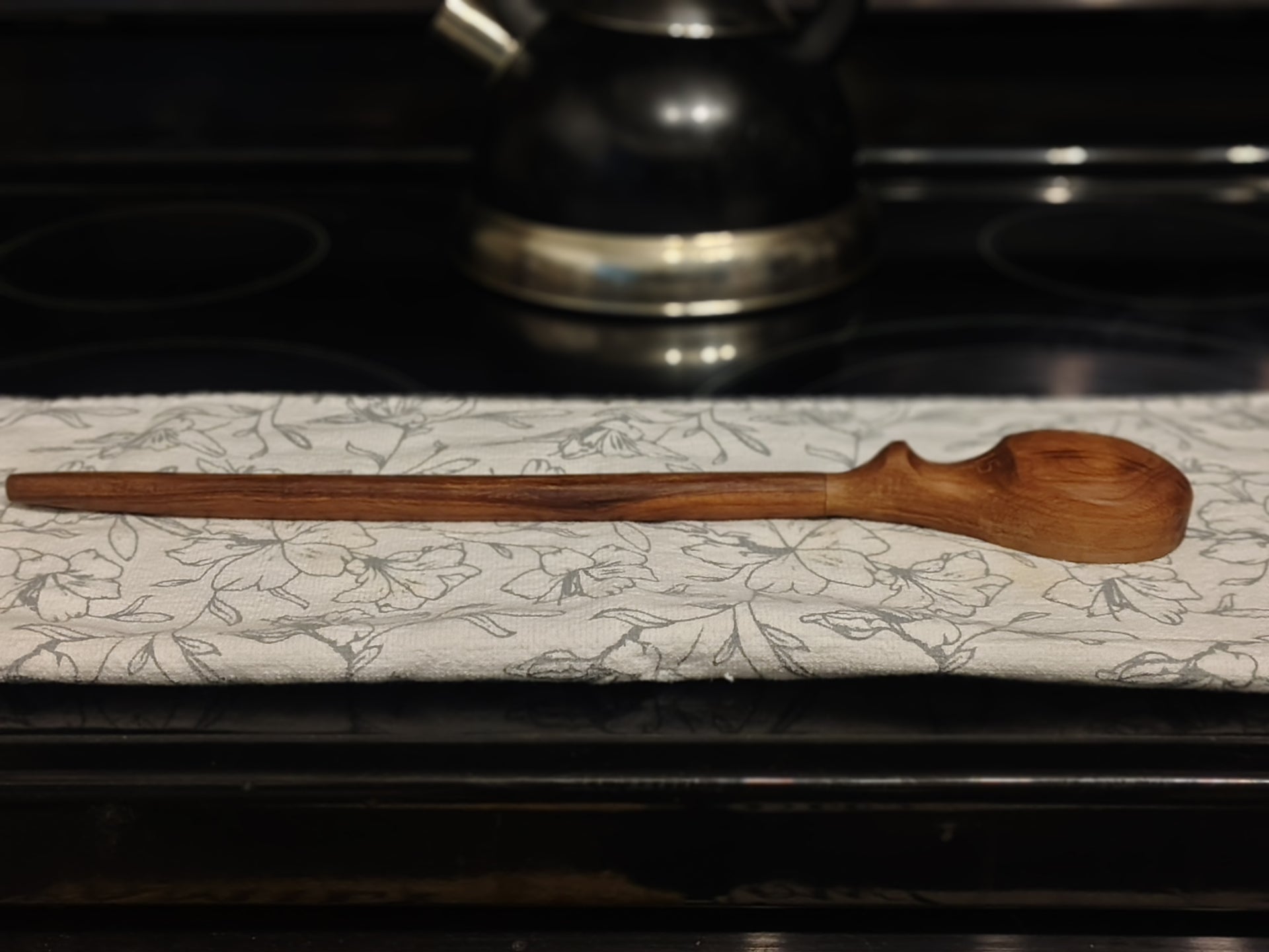 Wooden measuring spoon side view
